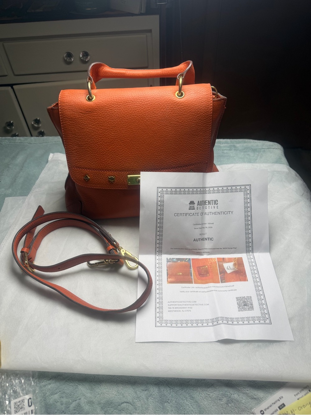Structured Orange Leather Satchel with Top Handle and Crossbody Strap